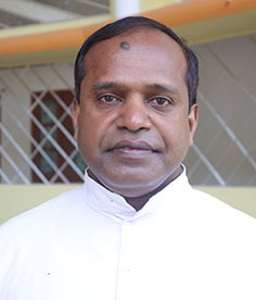 Dr Tious Tharakunnel